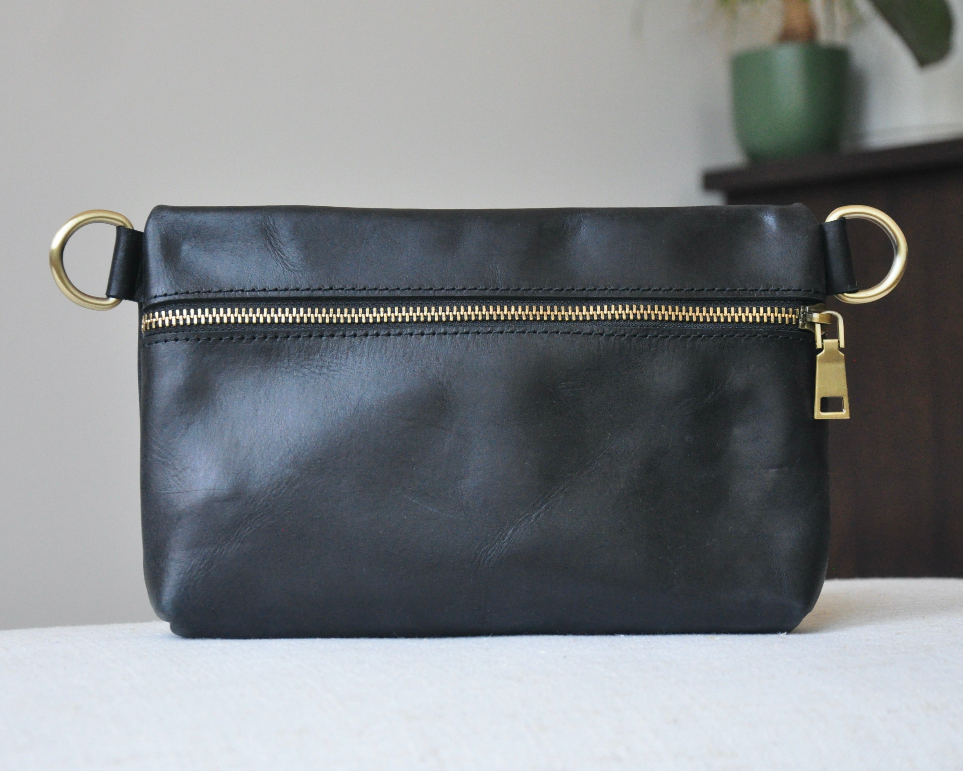 Crossbody Fanny Pack in black handmade from high-quality genuine leather with adjustable strap, brass hardware, and zipper closure. Full-grain leather Belt Bag with pocket for phone