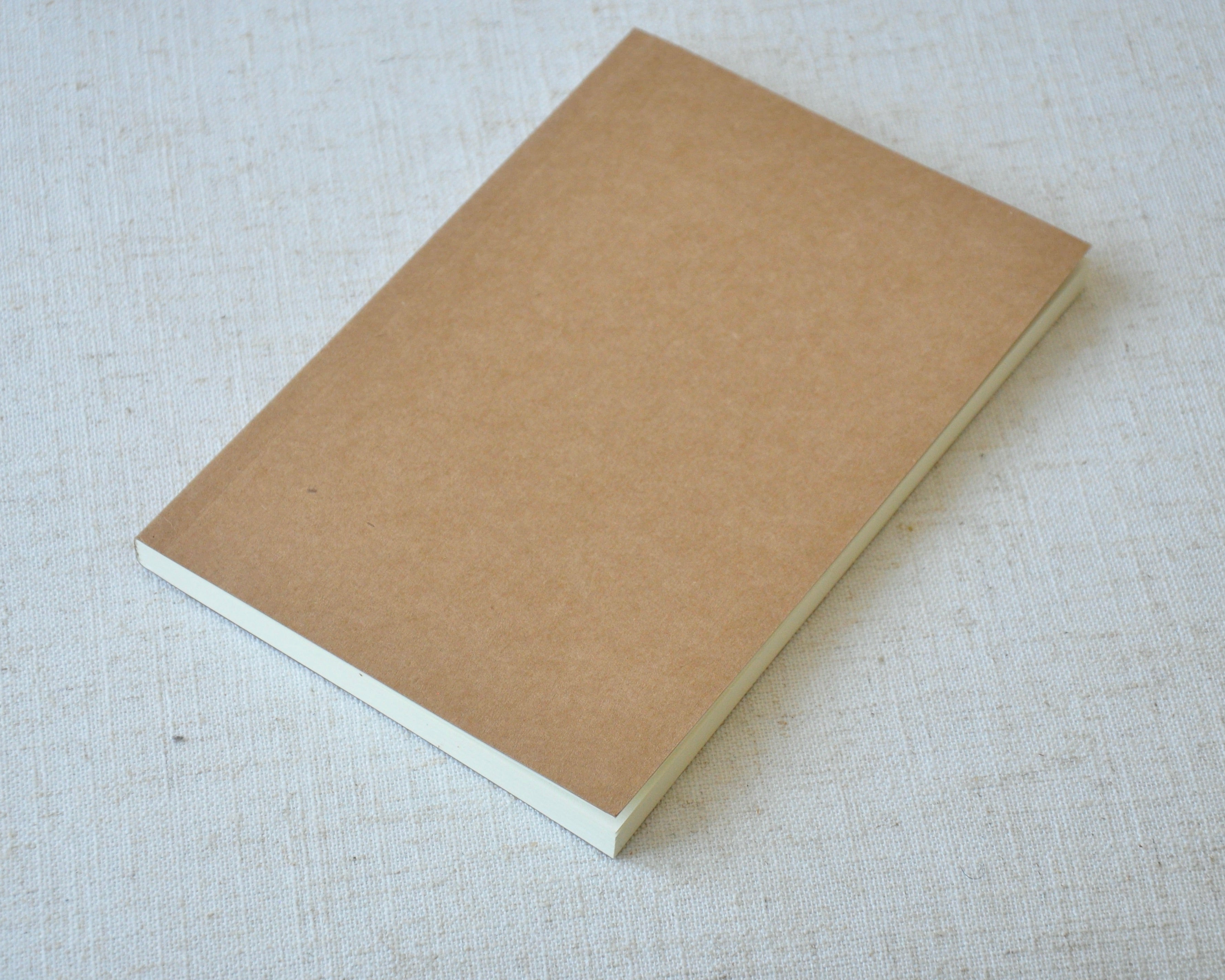 A5 journal with off-white, lined pages for leather notebook refill