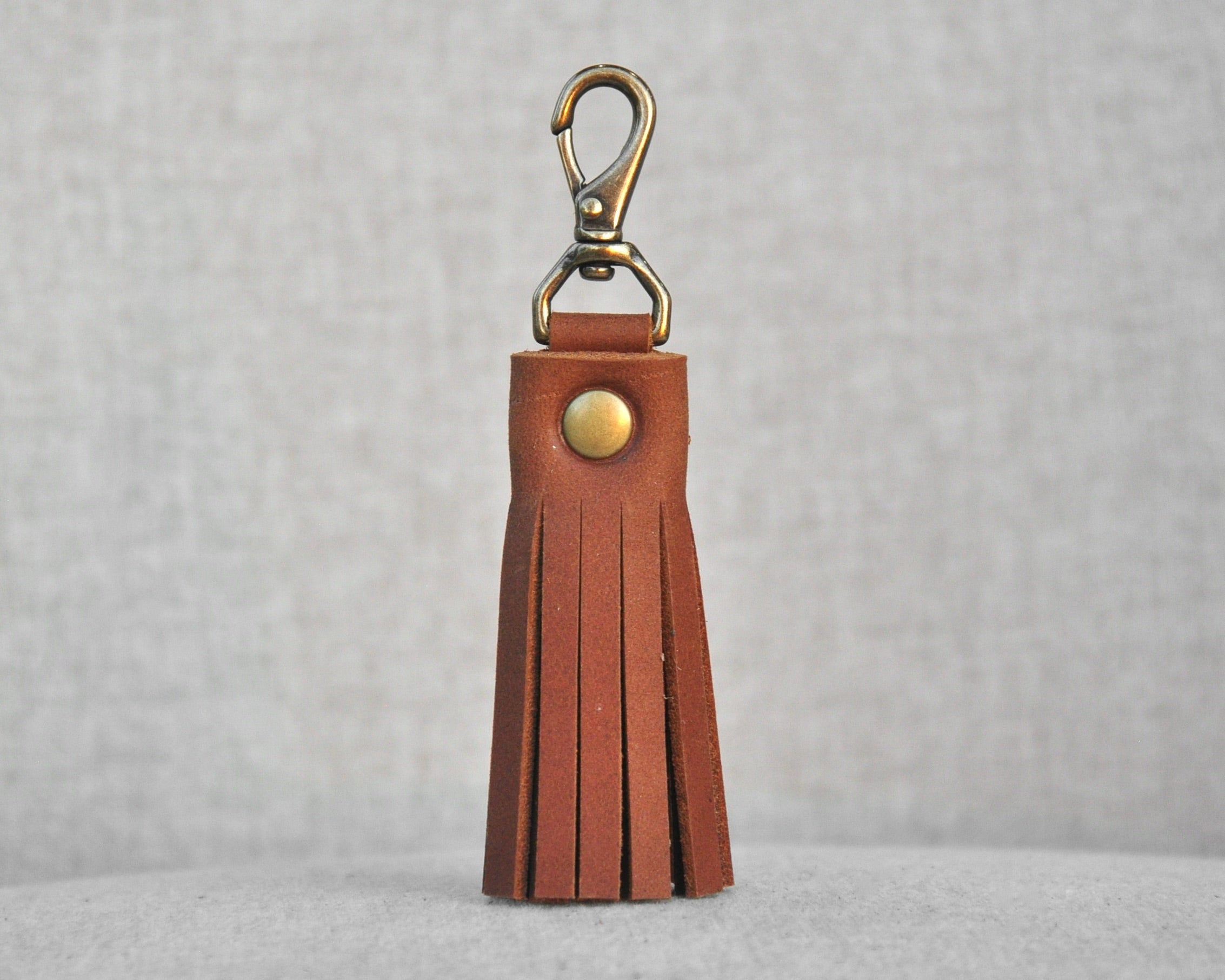 Tassel style leather purse charms with keychain hook and gold hardware