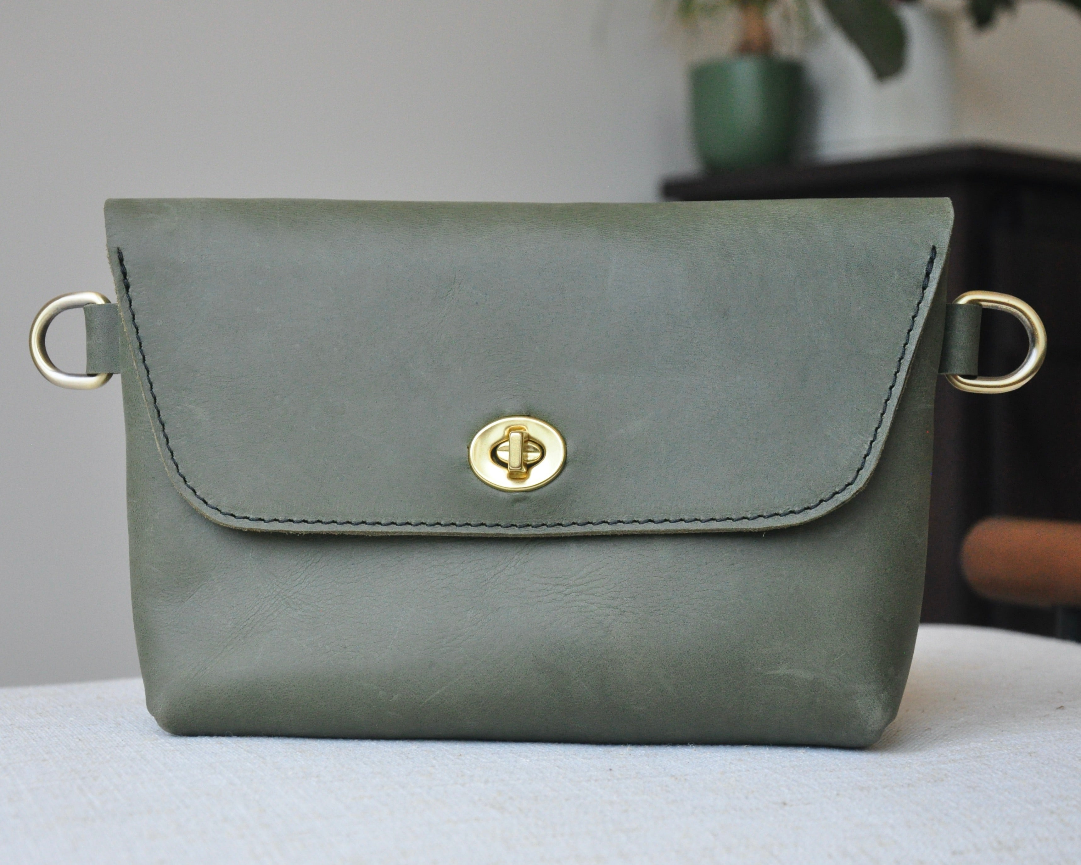 Crossbody Fanny Pack in olive handmade from high-quality genuine leather with adjustable strap, brass hardware, and twist lock closure. Full-grain leather Belt Bag with pocket for phone.