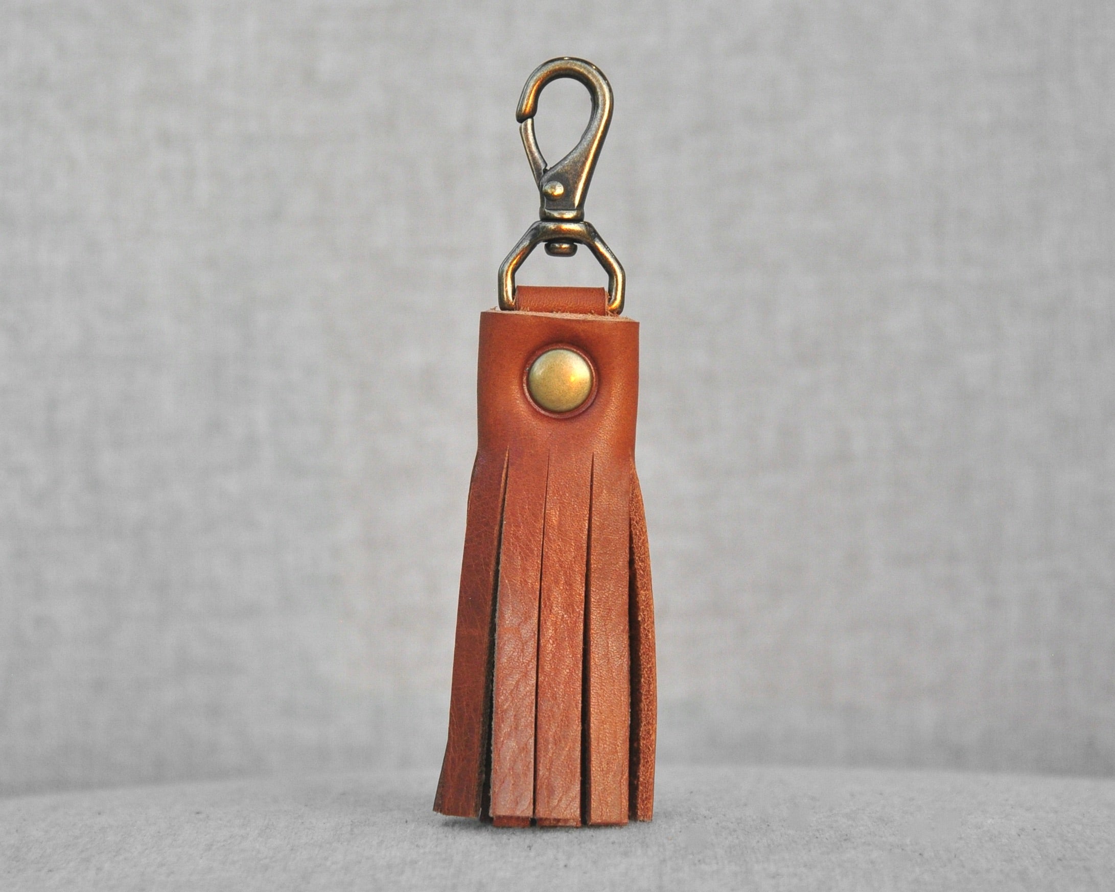 Tassel style leather purse charms with keychain hook and gold hardware