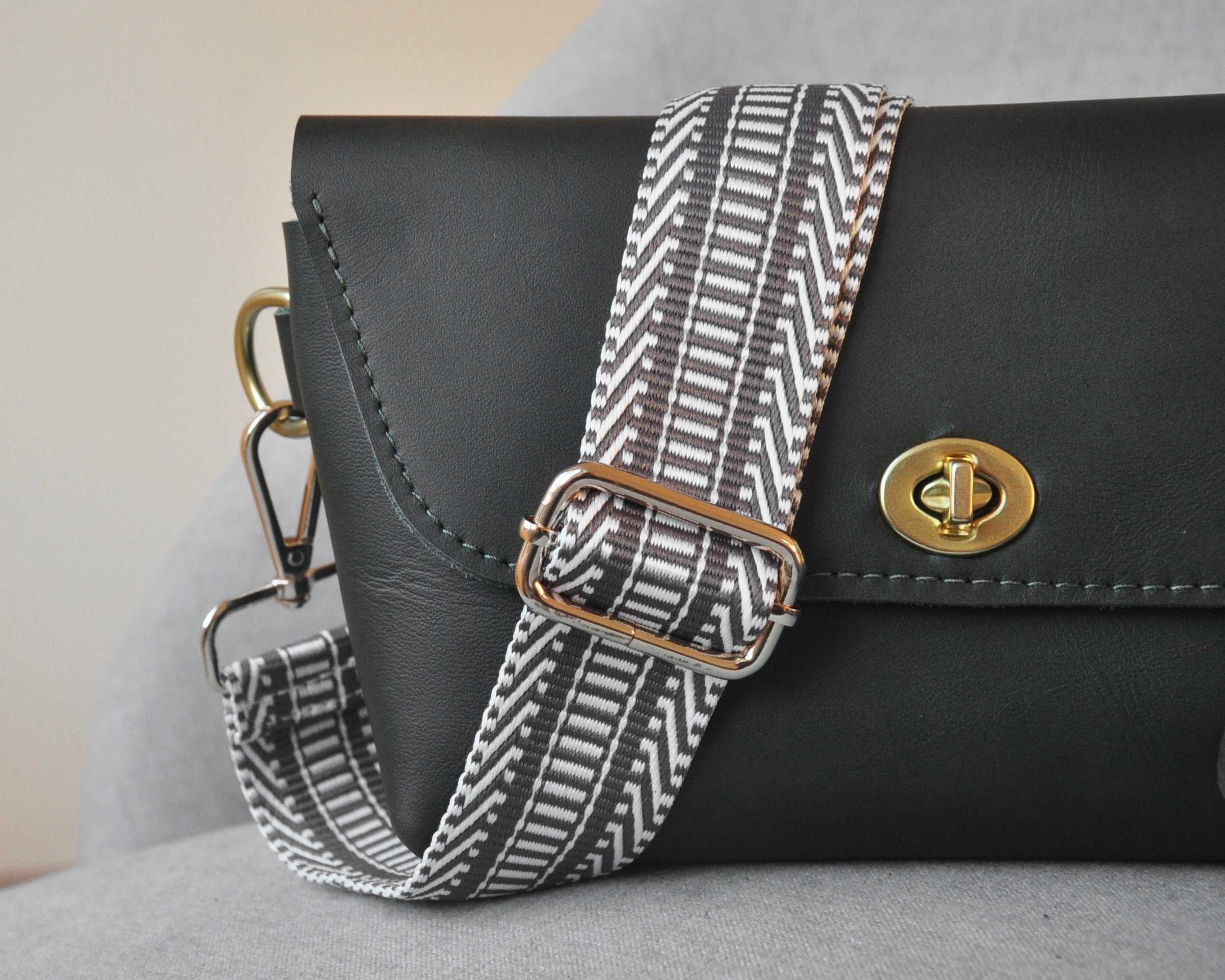 Patterned adjustable crossbody strap in neutral colors (tan, gray, and black) with gold hardware, perfect for customizing any purse or bag