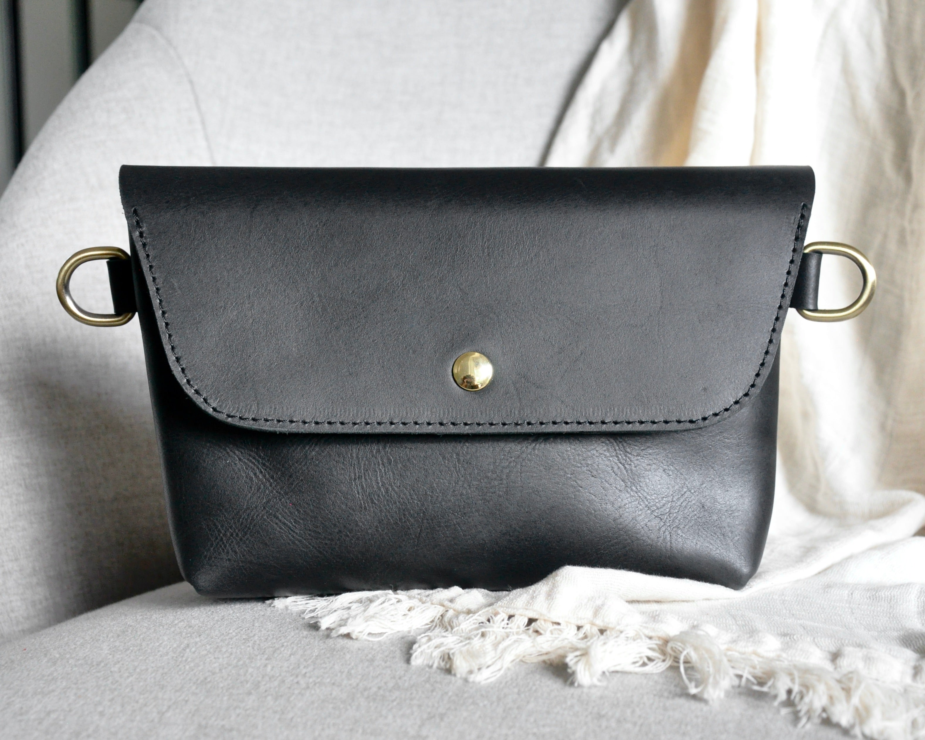 Crossbody Fanny Pack in black handmade from high-quality genuine leather with adjustable strap, brass hardware, and magnetic closure. Full-grain leather Belt Bag with pocket for phone.