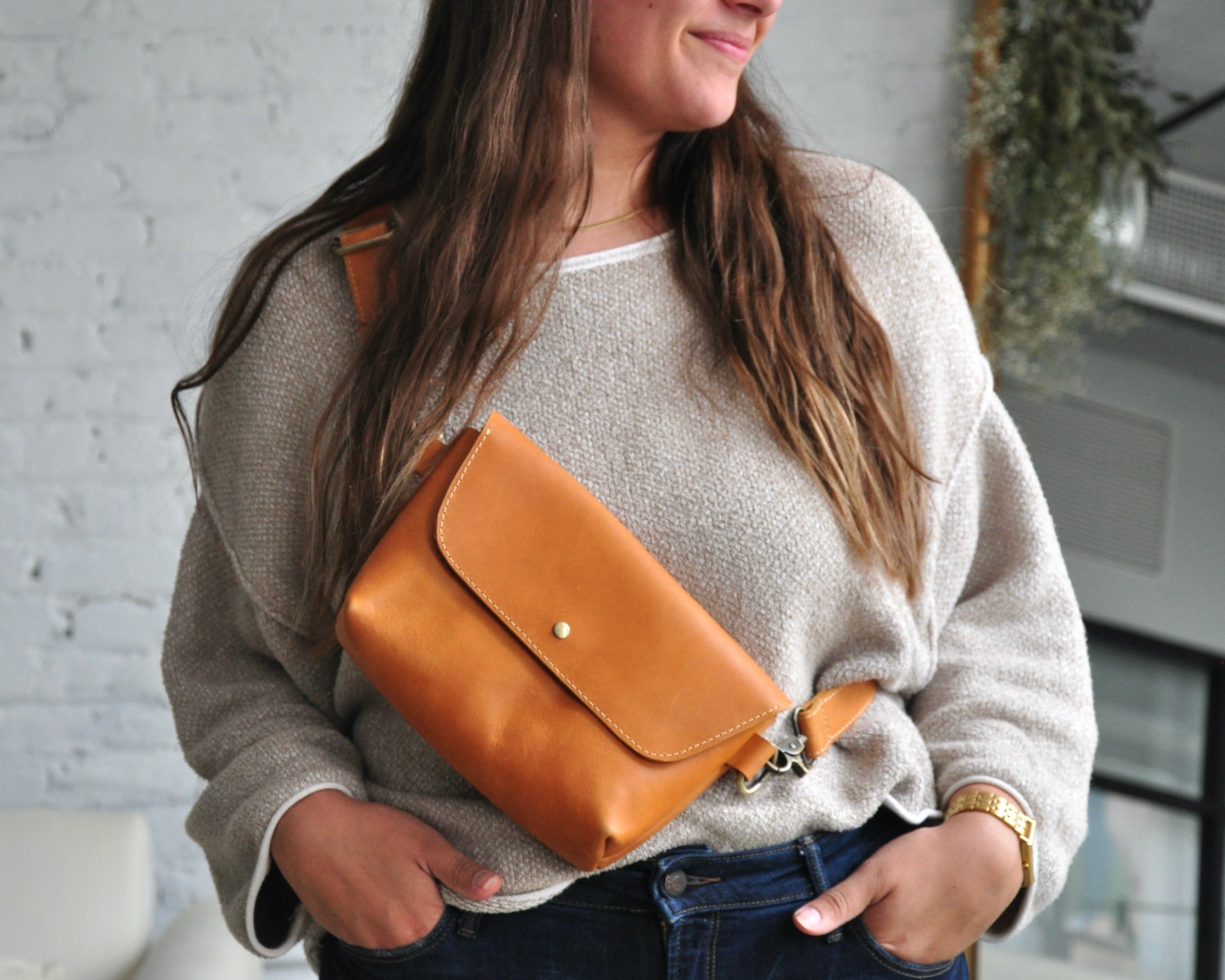 Crossbody Fanny Pack in tan handmade from high-quality genuine leather with adjustable strap, brass hardware, and twist lock closure. Full-grain leather Belt Bag with pocket for phone.
