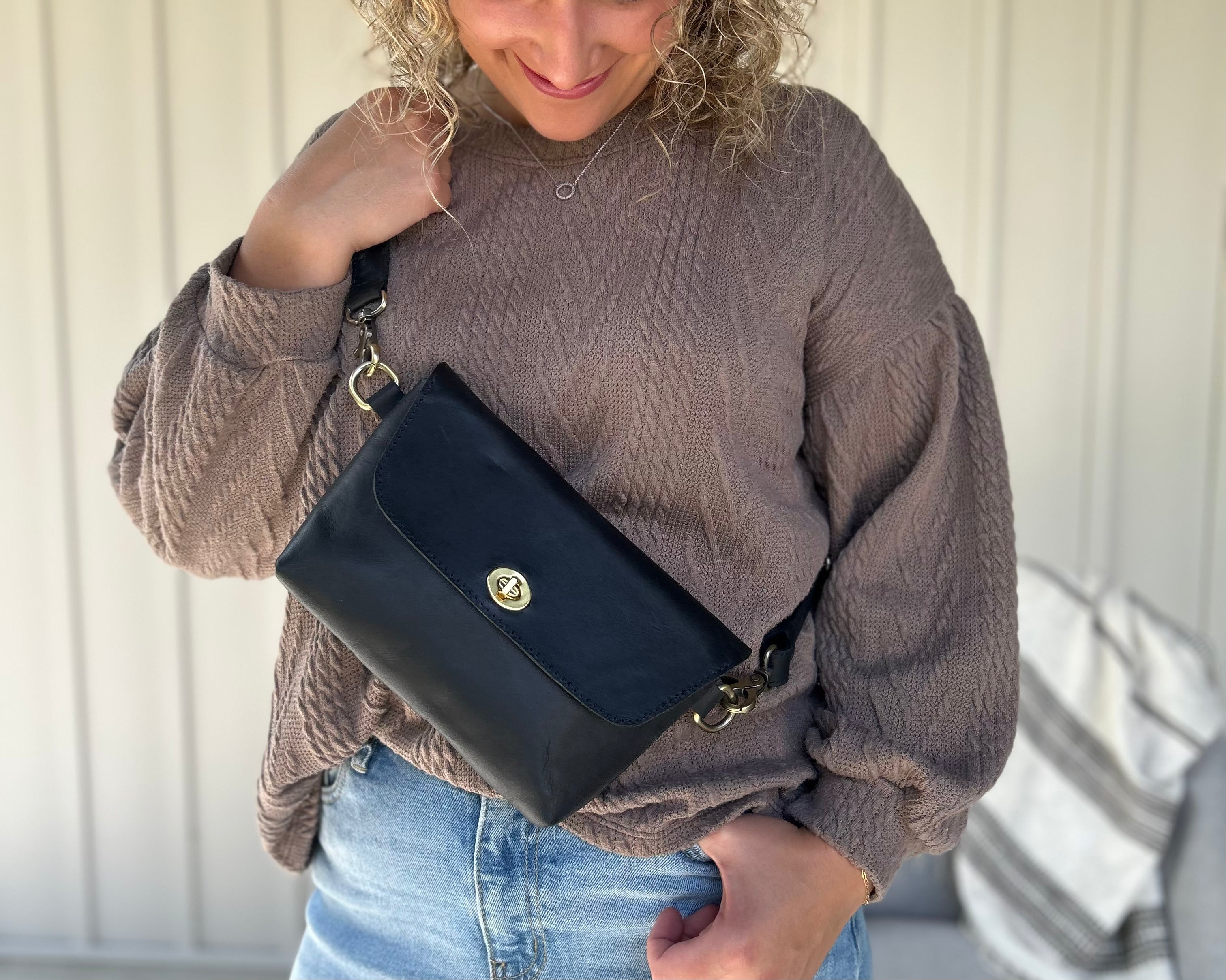 Crossbody Fanny Pack in black handmade from high-quality genuine leather with adjustable strap, brass hardware, and twist lock closure. Full-grain leather Belt Bag with pocket for phone.