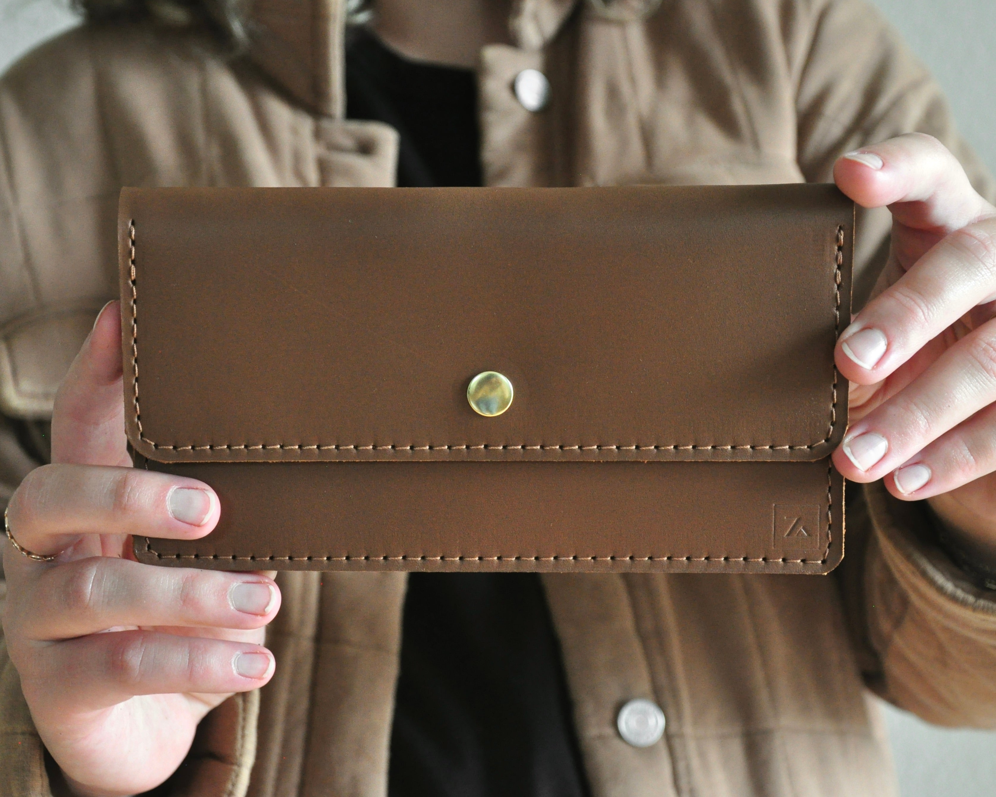 Brown Leather Wallet Clutch with smooth finish and stitching along the edges