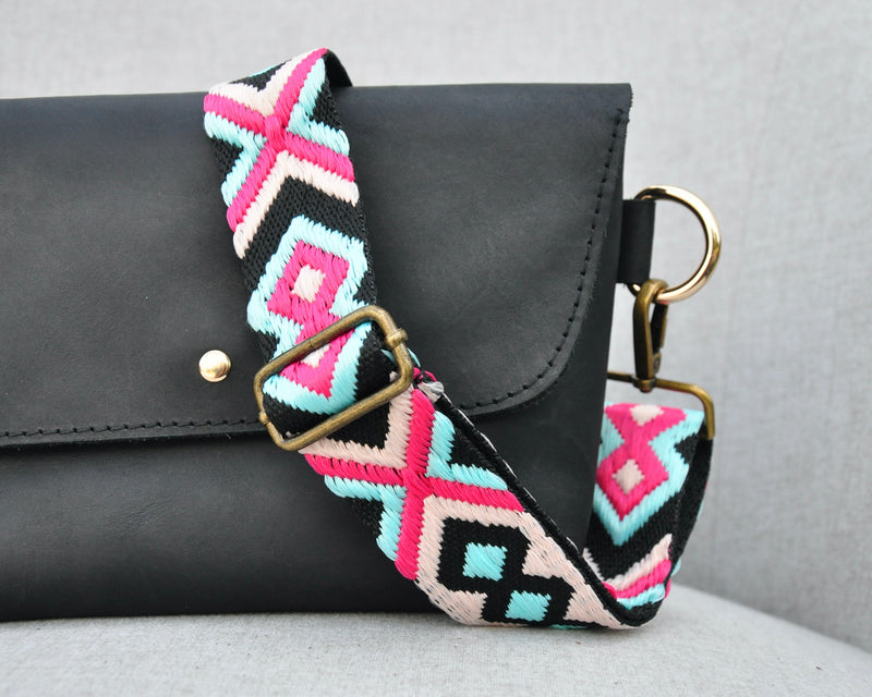 Geometric Crossbody Strap in Pink, Blue, and Black on a Black Leather Bag