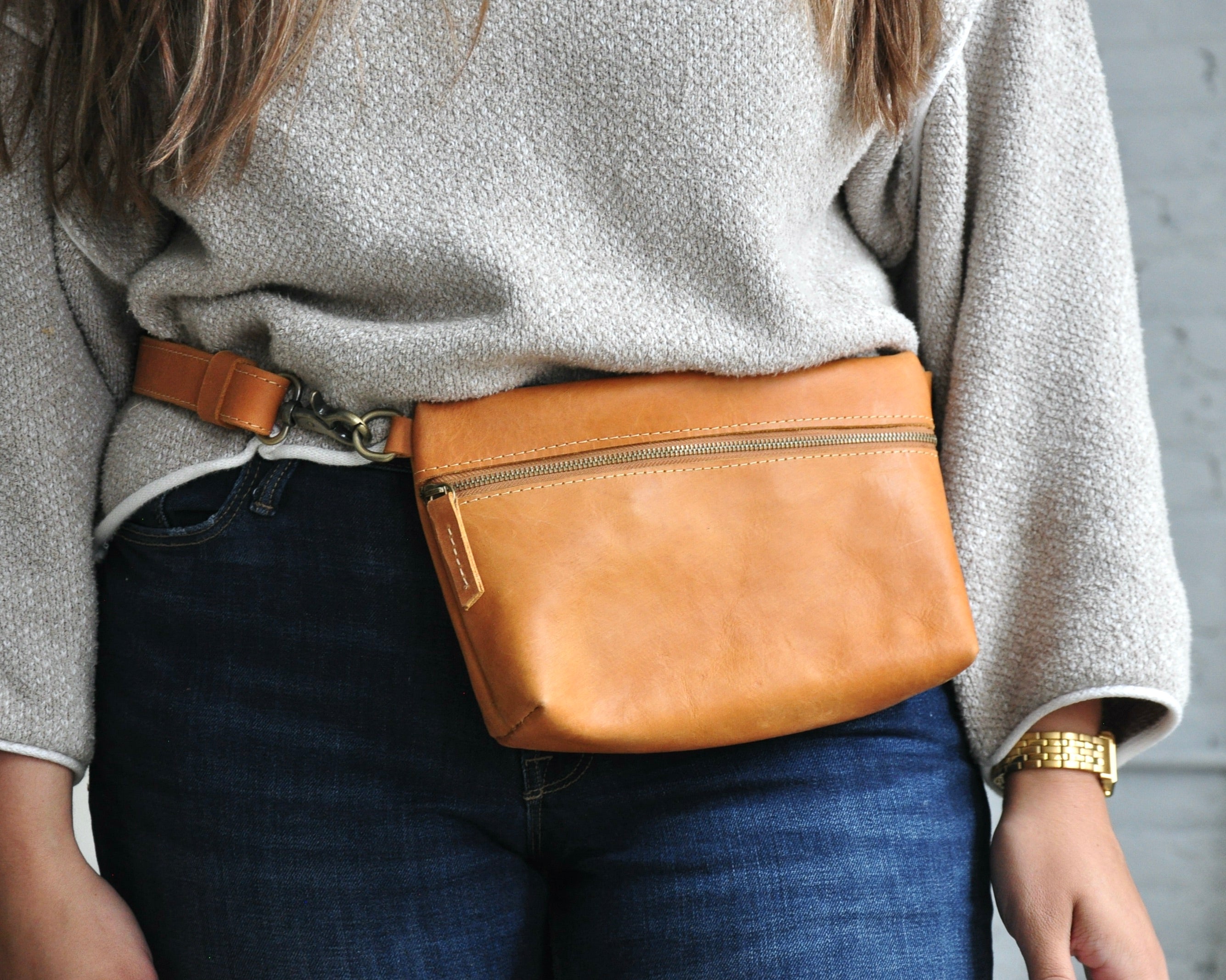 Crossbody Fanny Pack in tan handmade from high-quality genuine leather with adjustable strap, brass hardware, and zipper closure. Full-grain leather Belt Bag.
