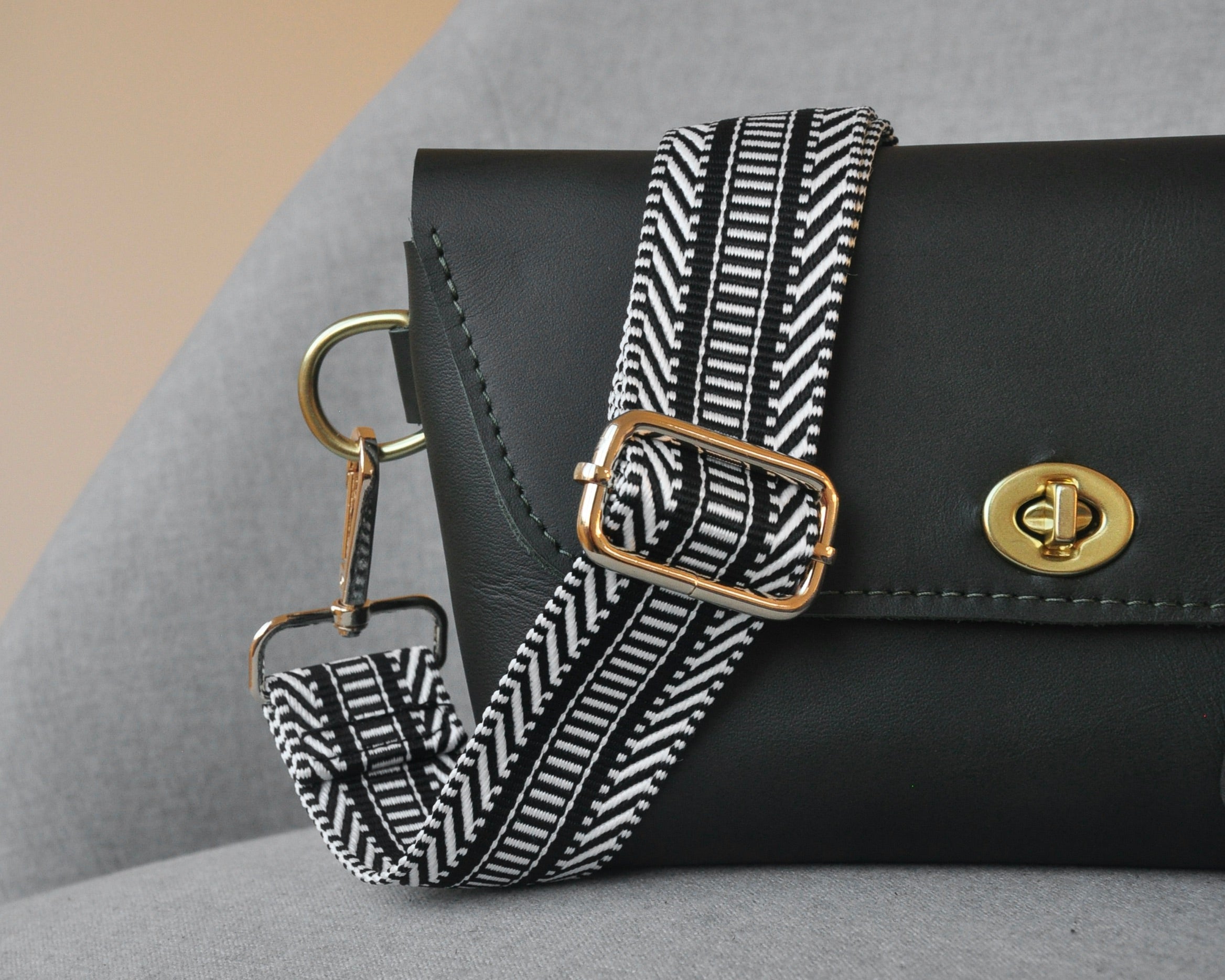Patterned adjustable crossbody strap in neutral colors (tan, gray, and black) with gold hardware, perfect for customizing any purse or bag