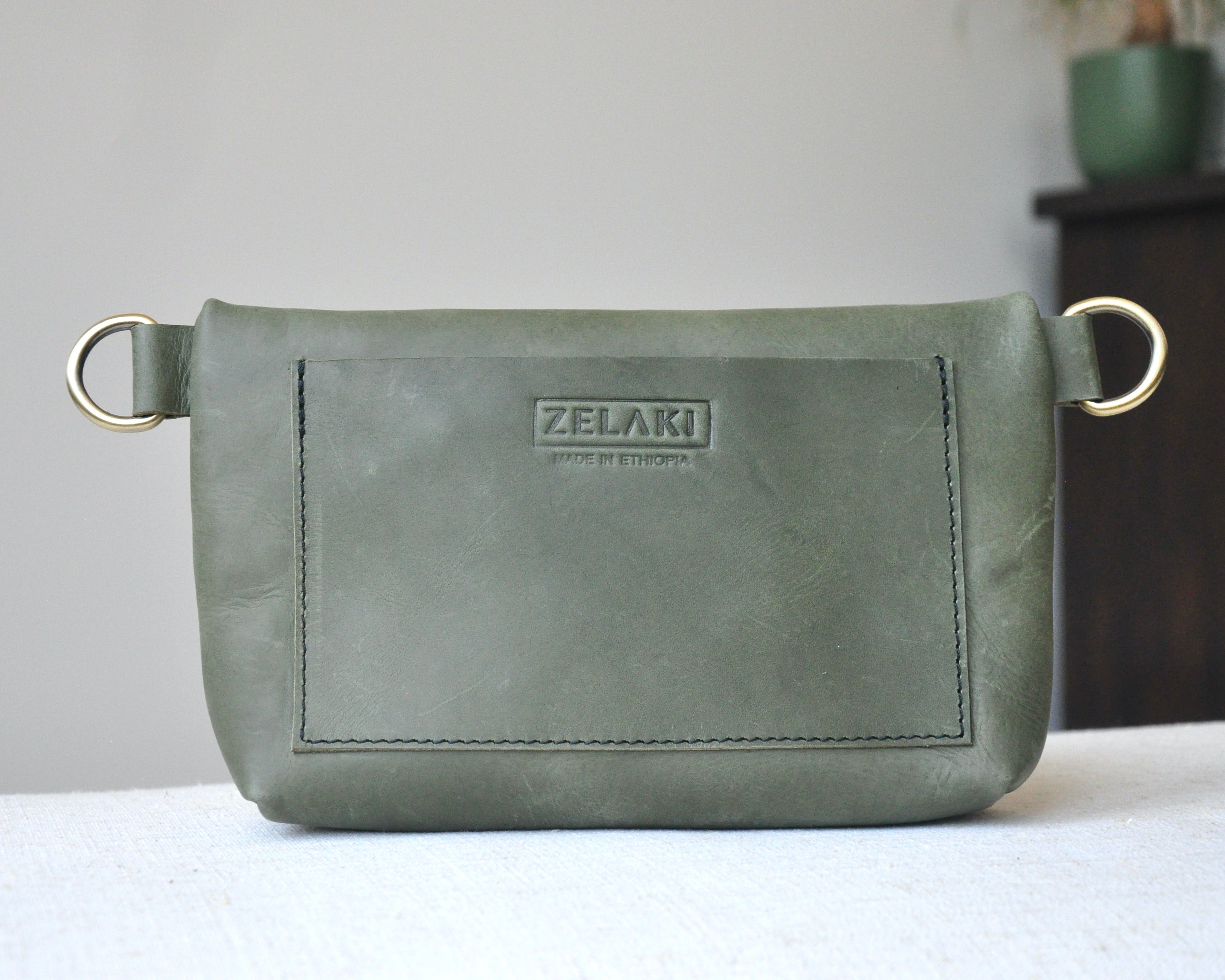 Crossbody Fanny Pack in black handmade from high-quality genuine leather with adjustable strap, brass hardware, and zipper closure. Full-grain leather Belt Bag with pocket for phone