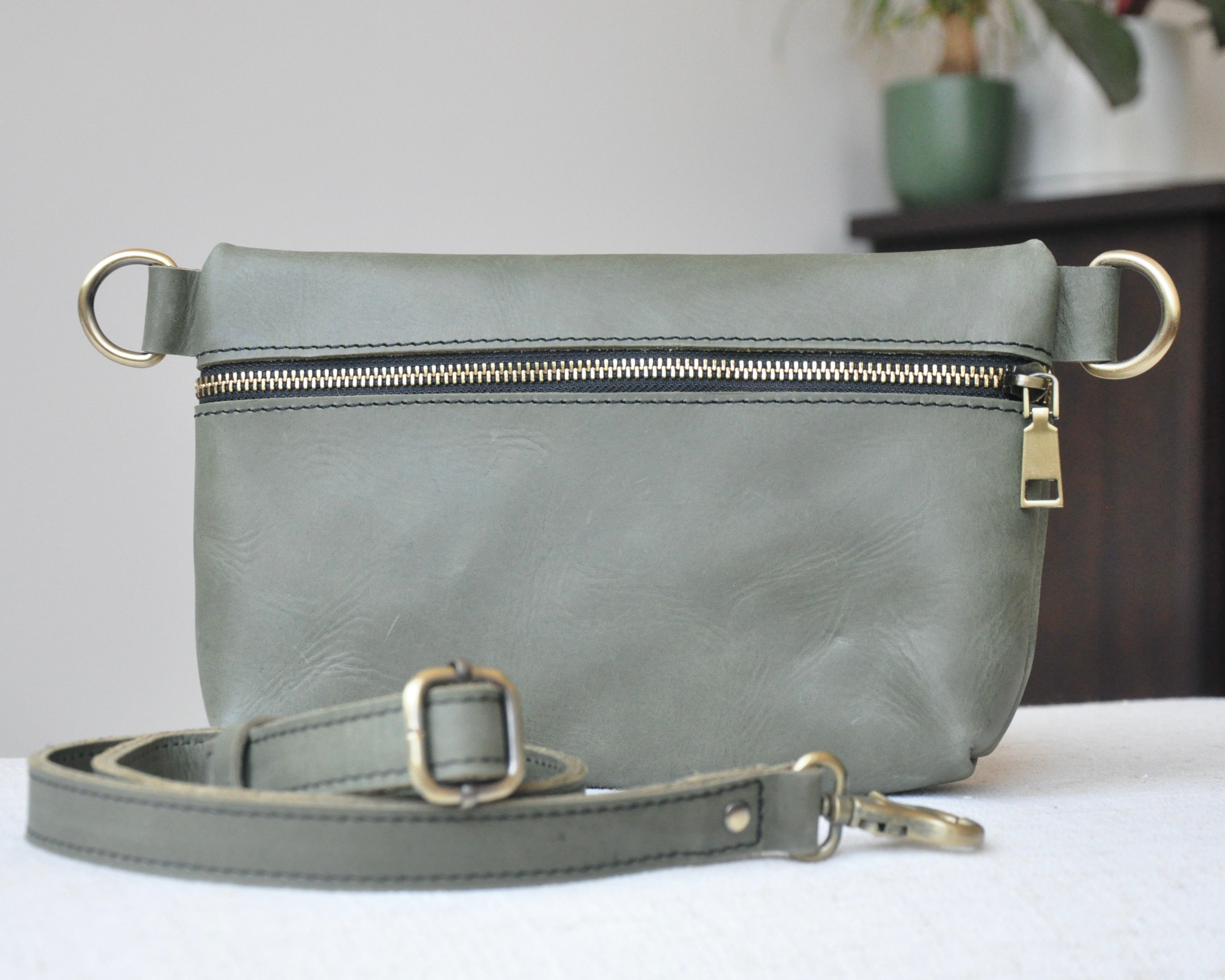 Crossbody Fanny Pack in olive handmade from high-quality genuine leather with adjustable strap, brass hardware, and zipper closure. Full-grain leather Belt Bag with pocket for phone
